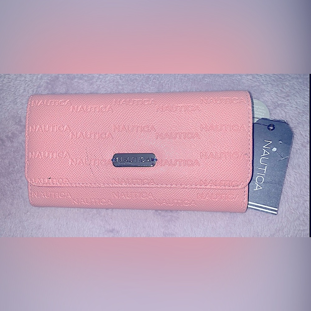Brand new unused with tags Nautica wallet. Color Pink/Blush, has RFID Blocking